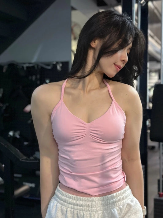Camiseta Deportiva Sin Costuras para Mujer – Tiras Cruzadas y Cómoda