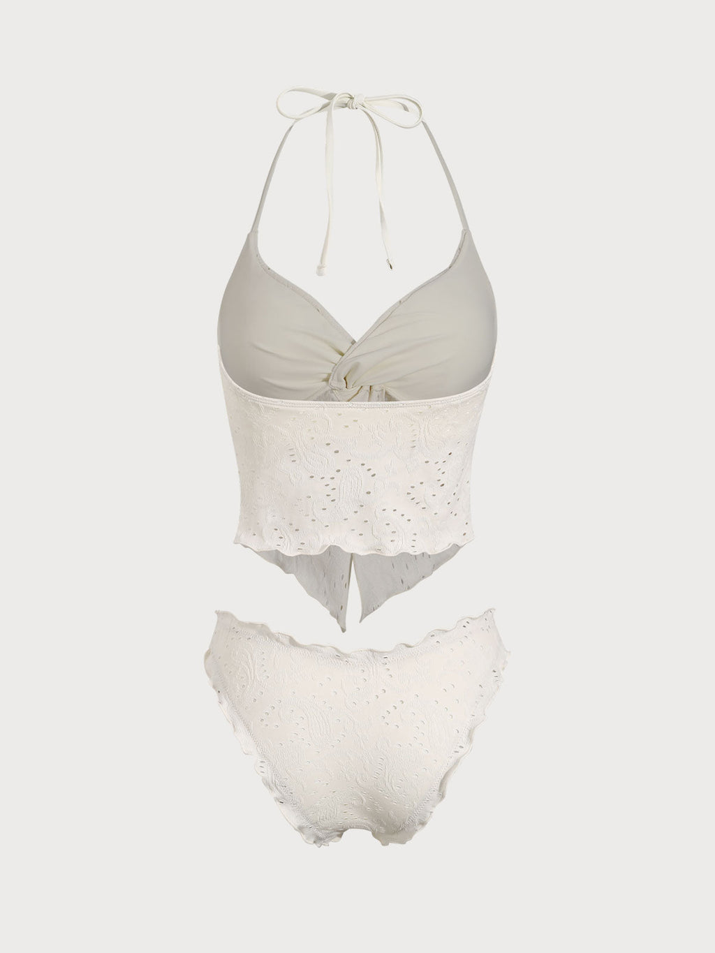 Conjunto de tankini blanco con diseño geométrico retorcido