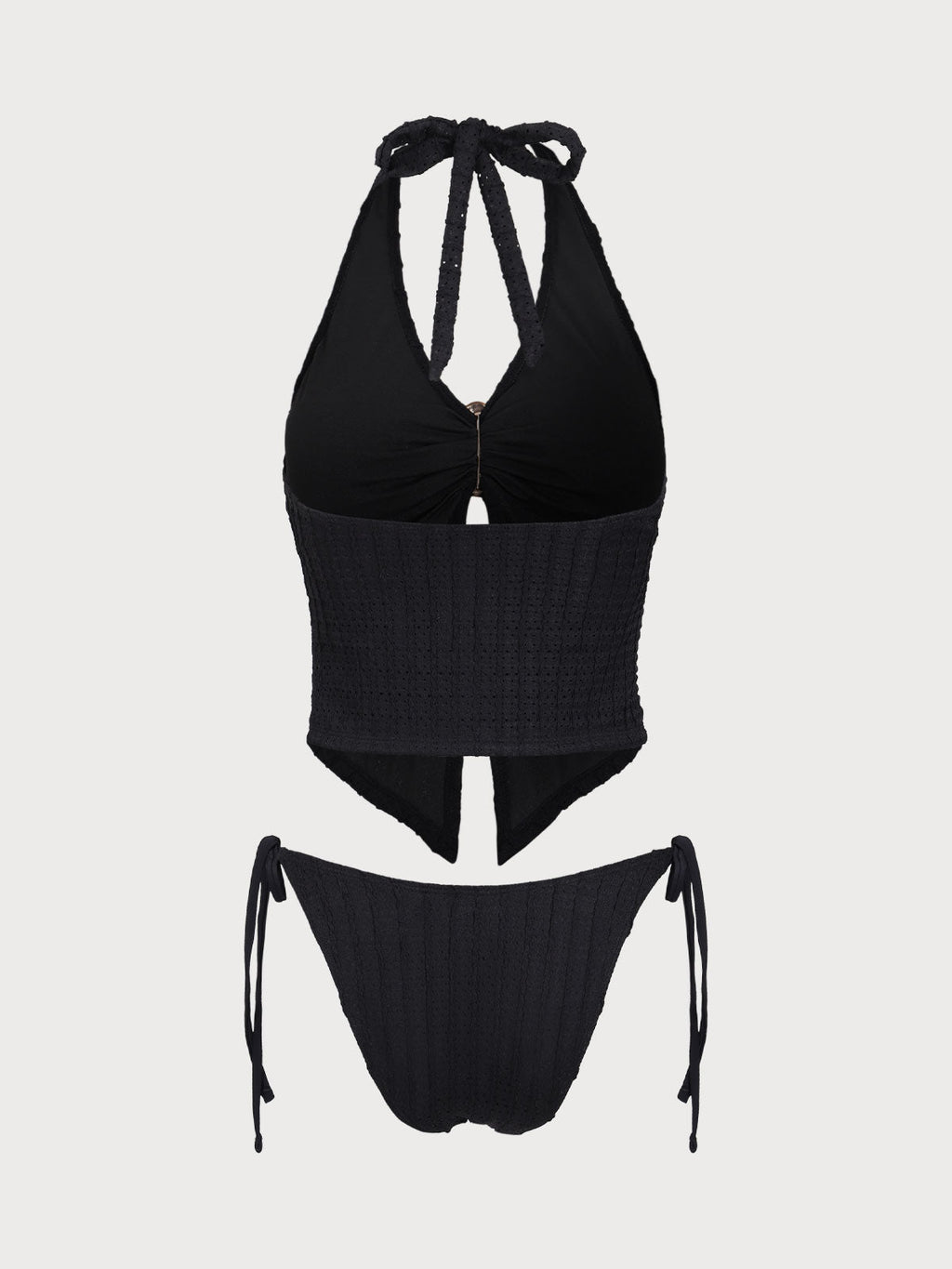 Conjunto de tankini negro con aberturas y estampado jacquard.