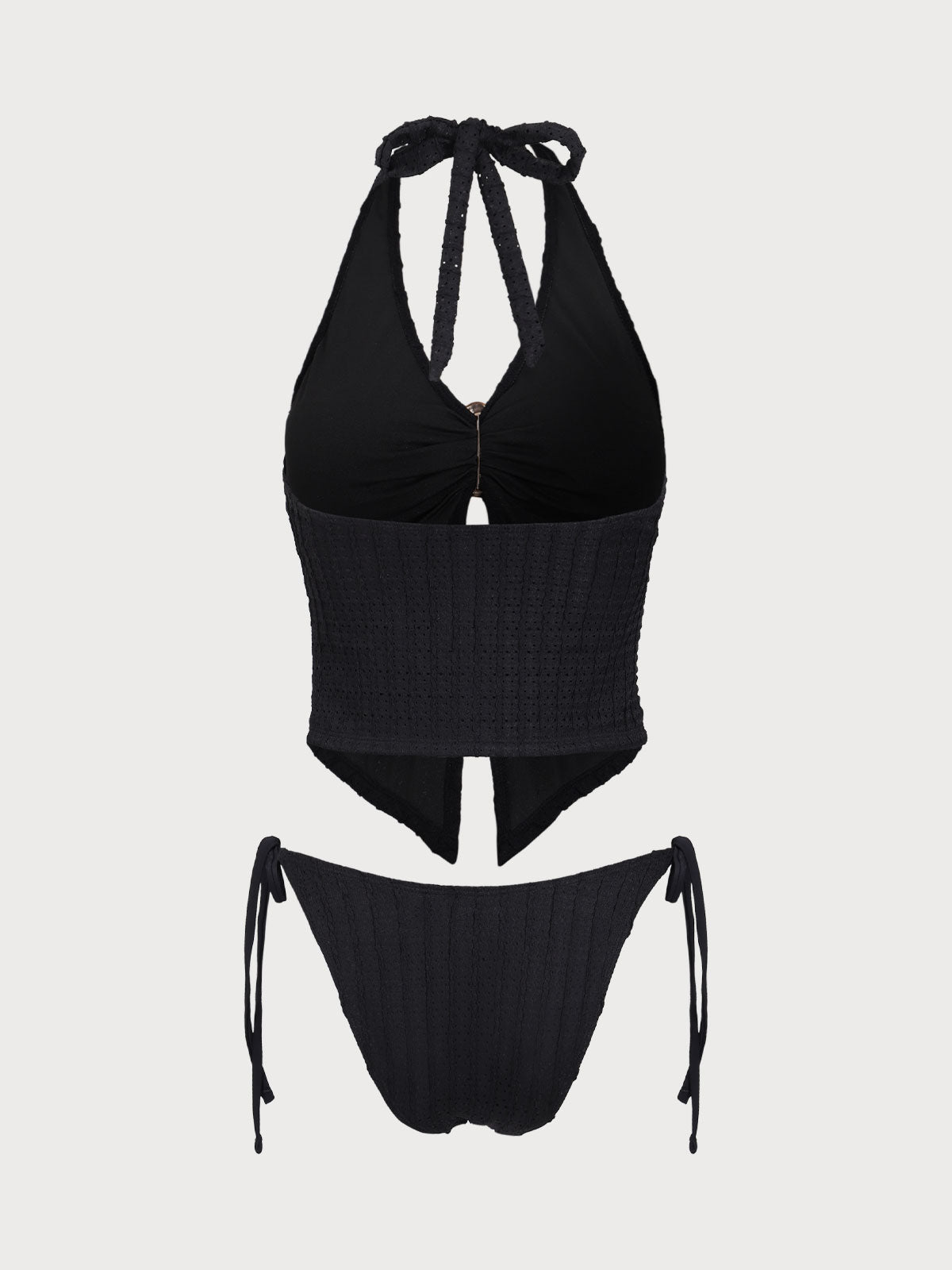 Conjunto de tankini negro con aberturas y estampado jacquard.